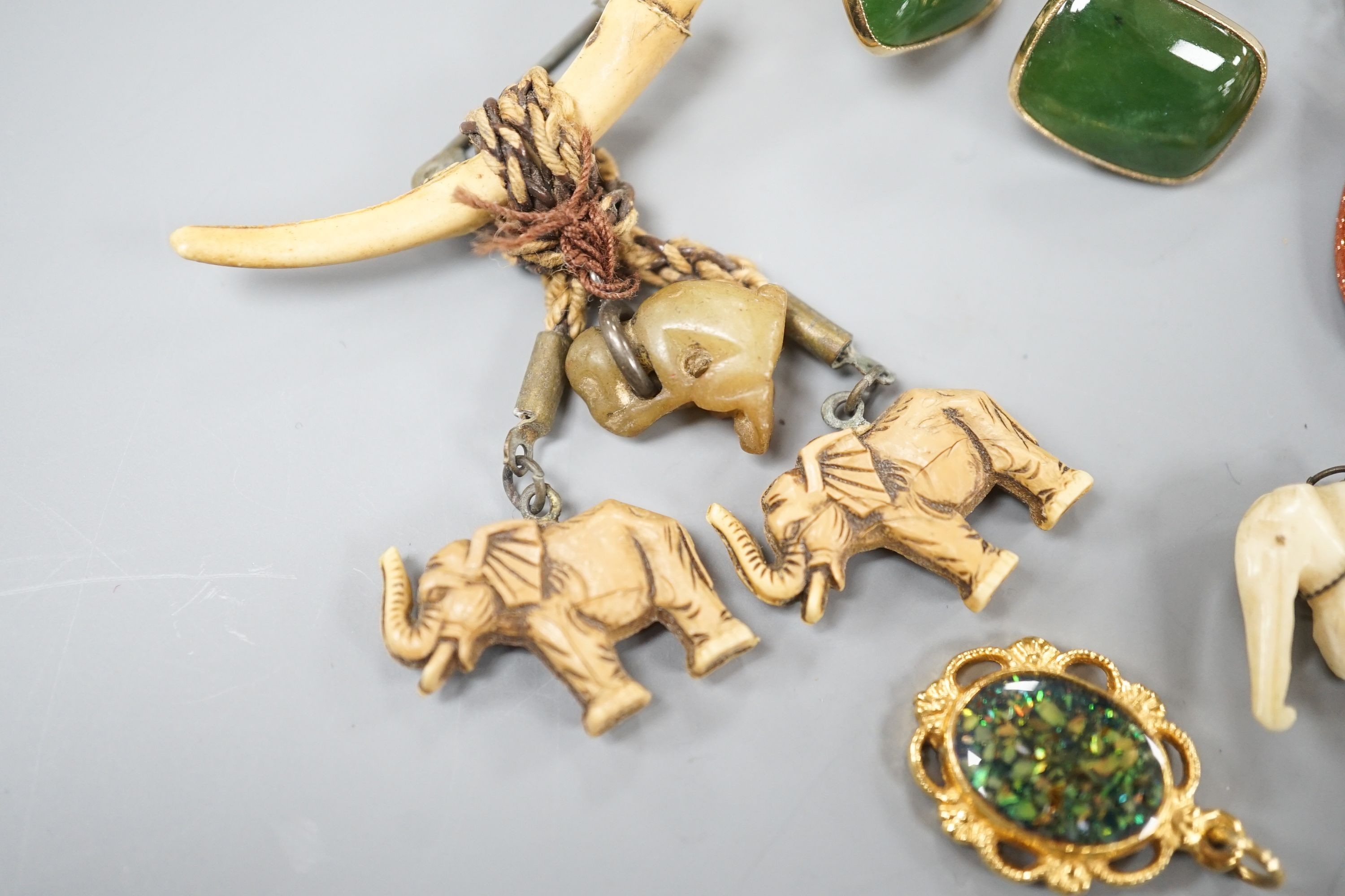 A pair of 9ct and nephrite set cufflinks, 16mm, gross weight 7.6 grams and a small quantity of assorted mainly costume jewellery including goldstone adventurine glass pendant.